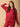 Woman wearing magenta maternity hoodie and pajama set from The Mom Store, designed for nursing comfort