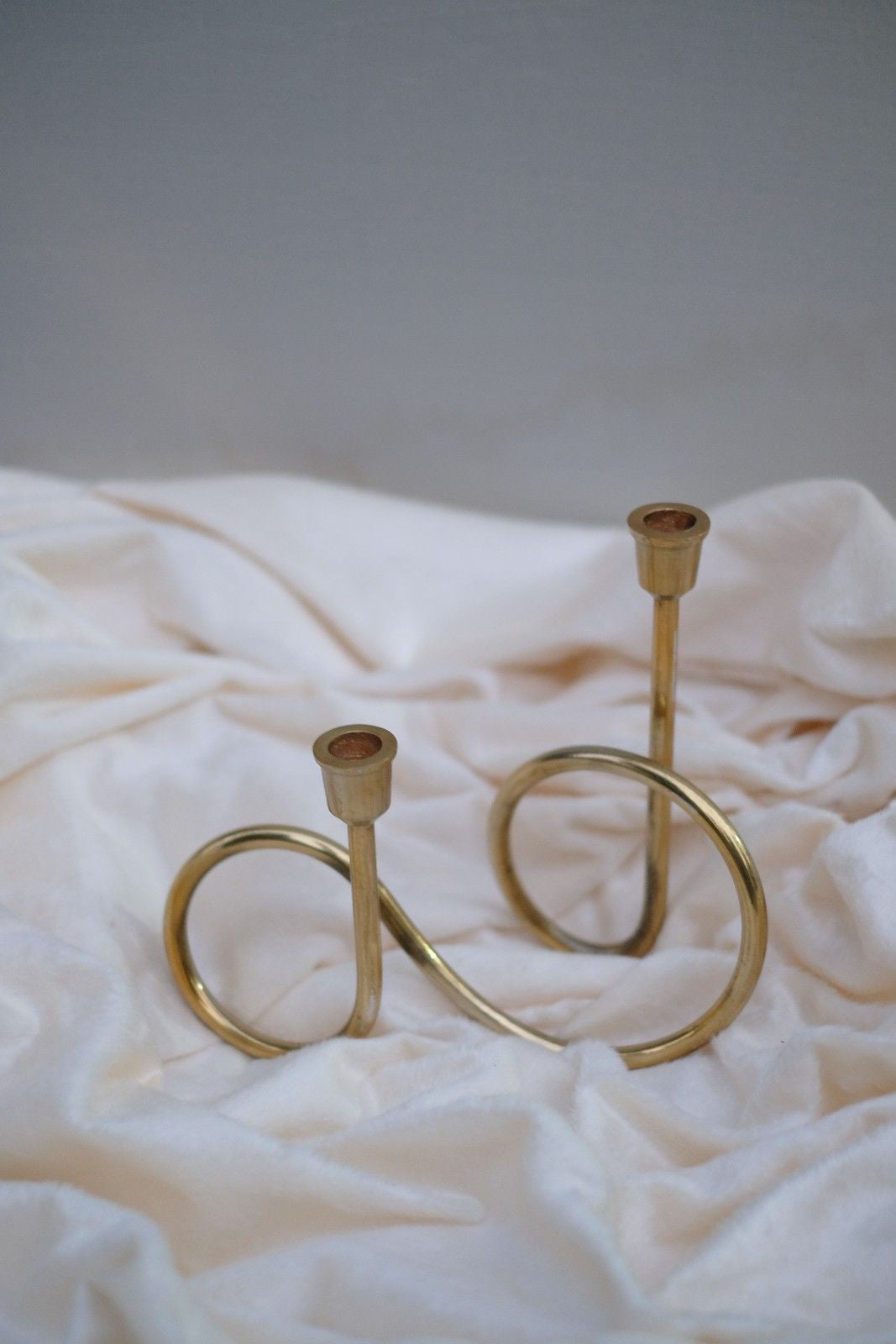 Swen BOAIN, modern brass infinity loop cndlestick holder by SWEN