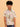 Child wearing a patterned shirt and jeans on a beige background