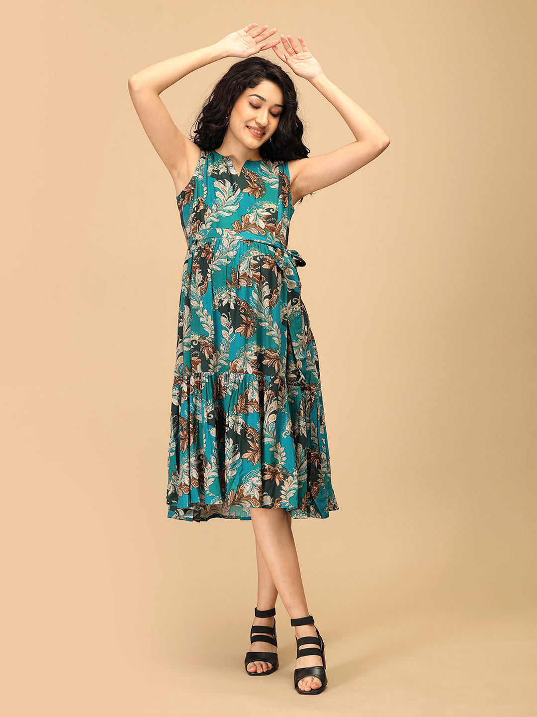 Maternity dress with teal botanical print and adjustable waist tie
