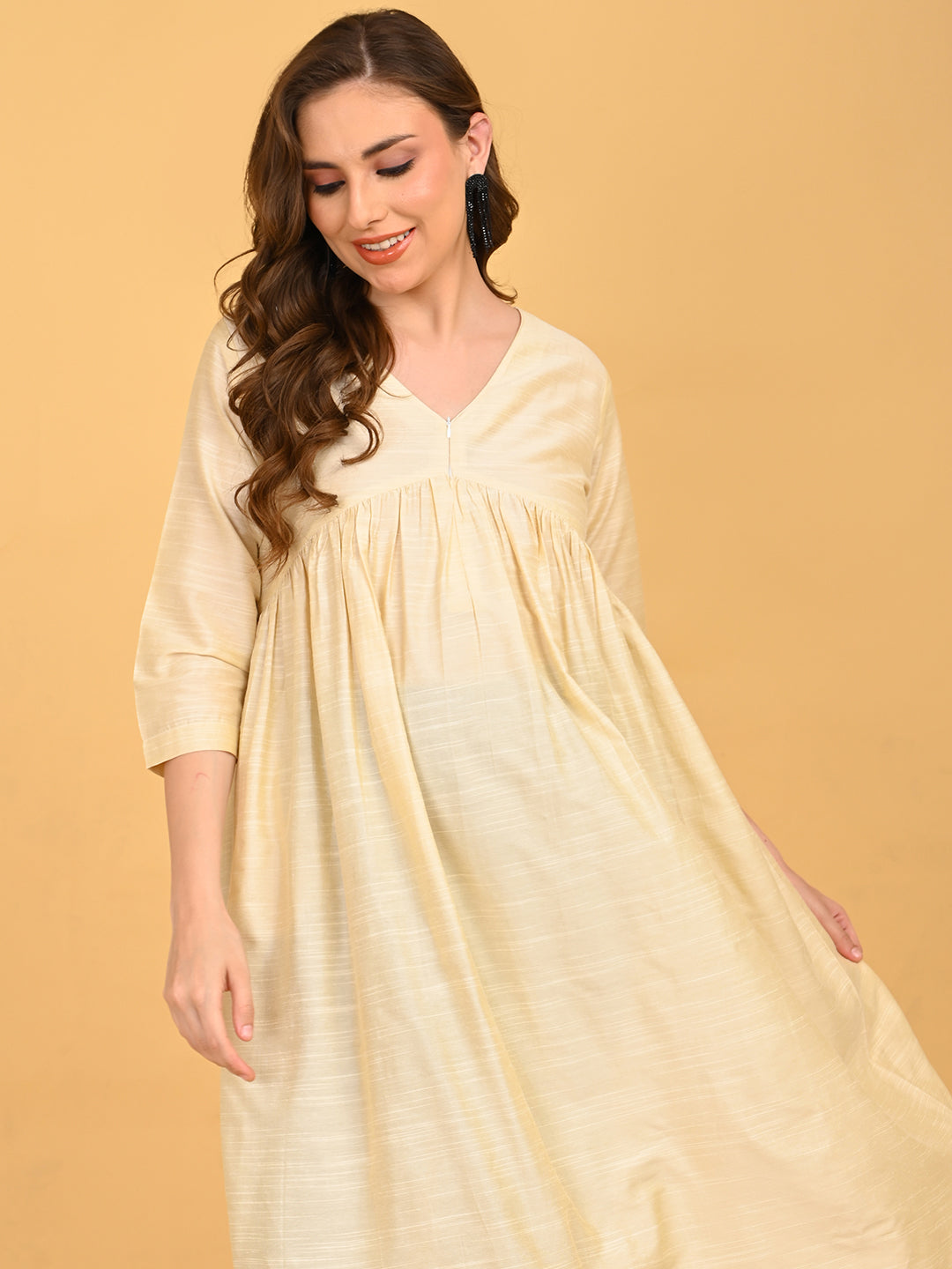 Upper body view of cream silk maternity kurta with V-neck and subtle sheen finish.