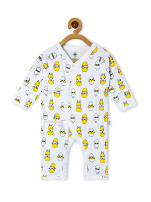 Close up Picture of backside of a jabla style romper with chick and egg designs from the mom store hanging on a rack