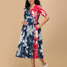 Front view of The Mom Store Dual Bloom maternity wrap dress in navy and pink floral print.