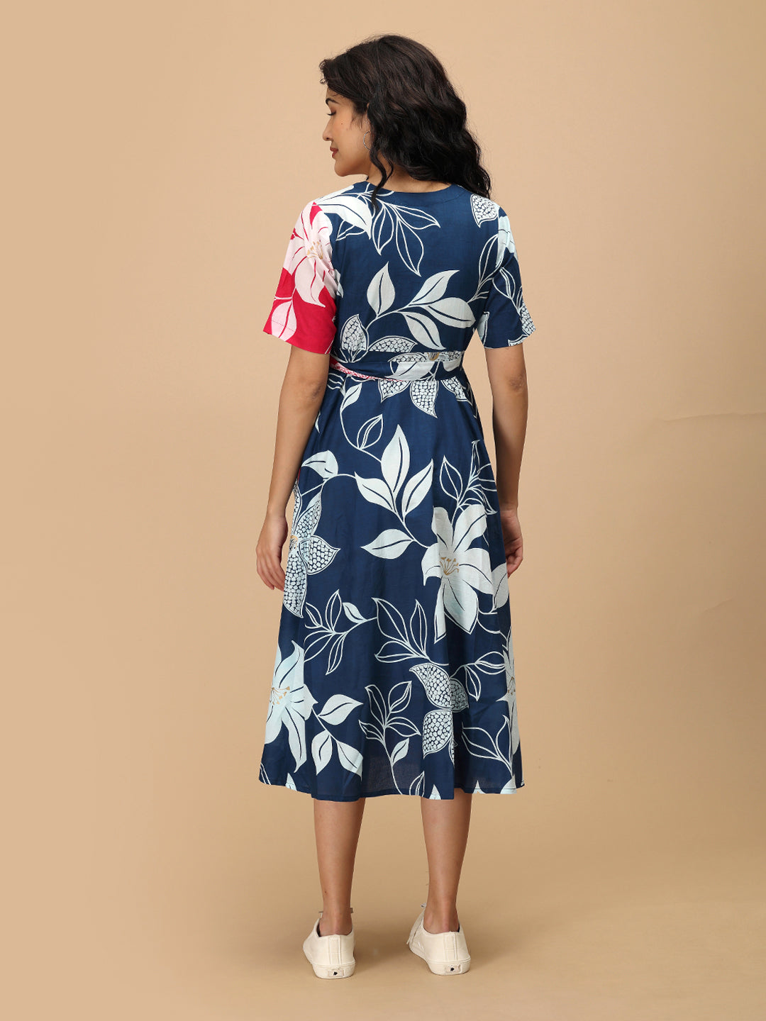Back view of The Mom Store Dual Bloom maternity wrap dress in dual-tone blue and pink print.