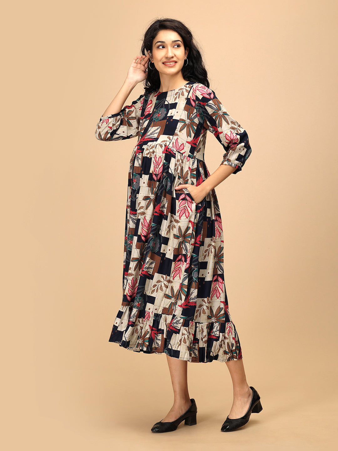 Side view of The Mom Store Muted Muse maternity and nursing dress with relaxed fit and ruffle hem.