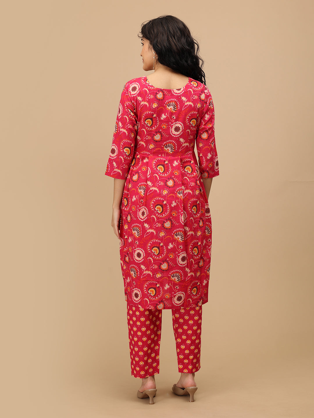 Back view of the printed pink maternity kurta and matching pants showing the straight hemline and three-quarter sleeves.