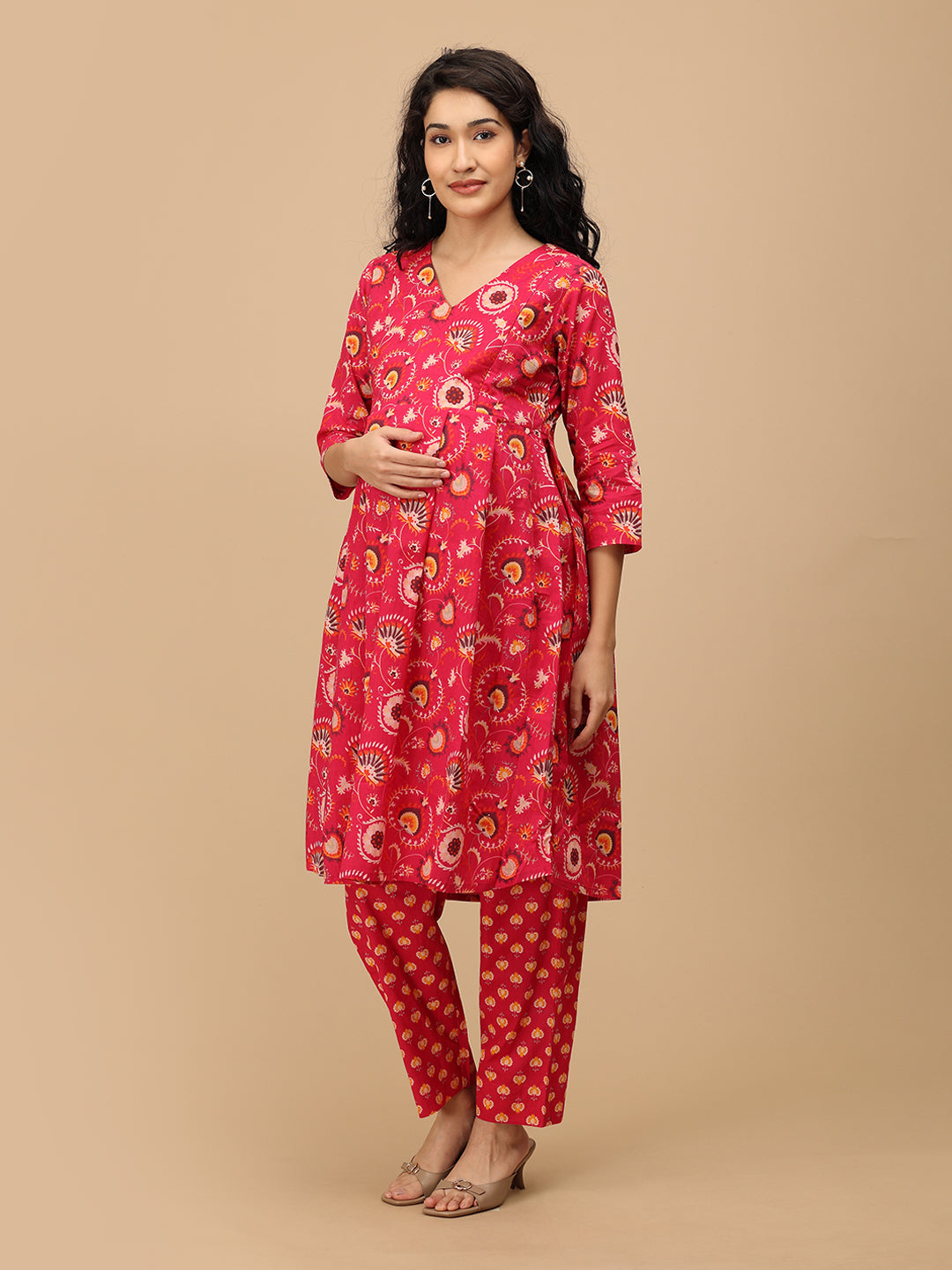 Side angle of the printed pink maternity pants showing the relaxed straight silhouette and comfortable fit.