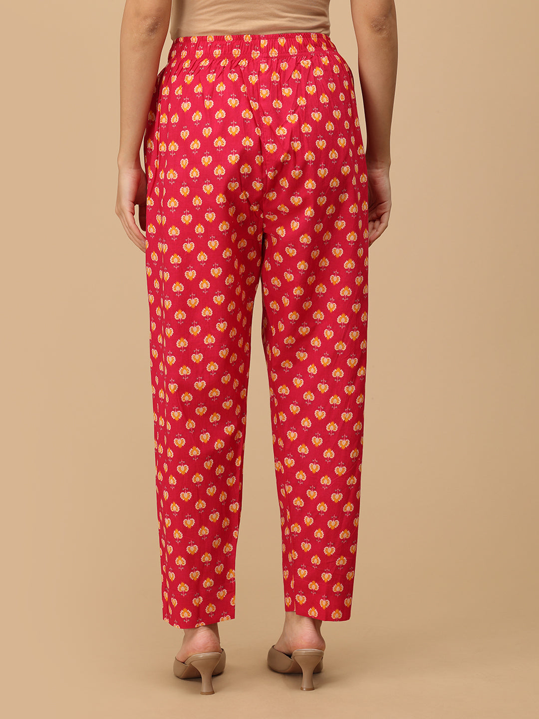Back view of printed pink straight-fit maternity pants with an elasticated waistband.