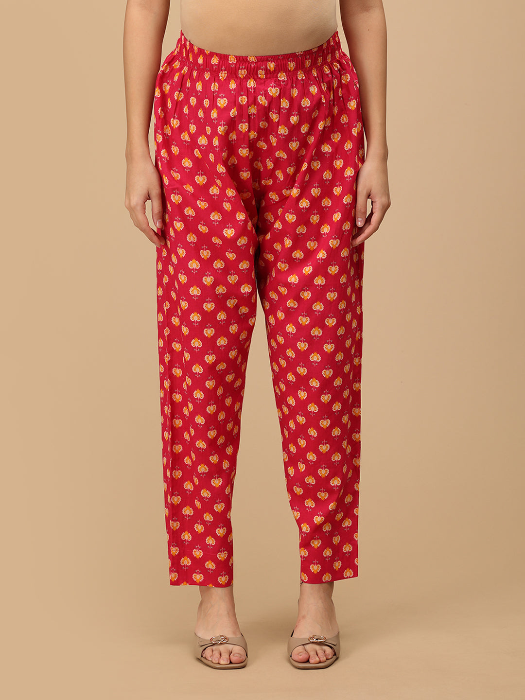 Front view of printed pink straight-fit maternity pants with an elasticated waistband.