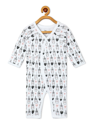 Close up Picture of jabla style romper with unicorn designs from the mom store hanging on a rack