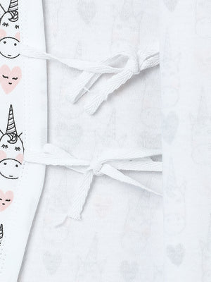 Picture side ties of a jabla style romper with unicorn design from the mom store