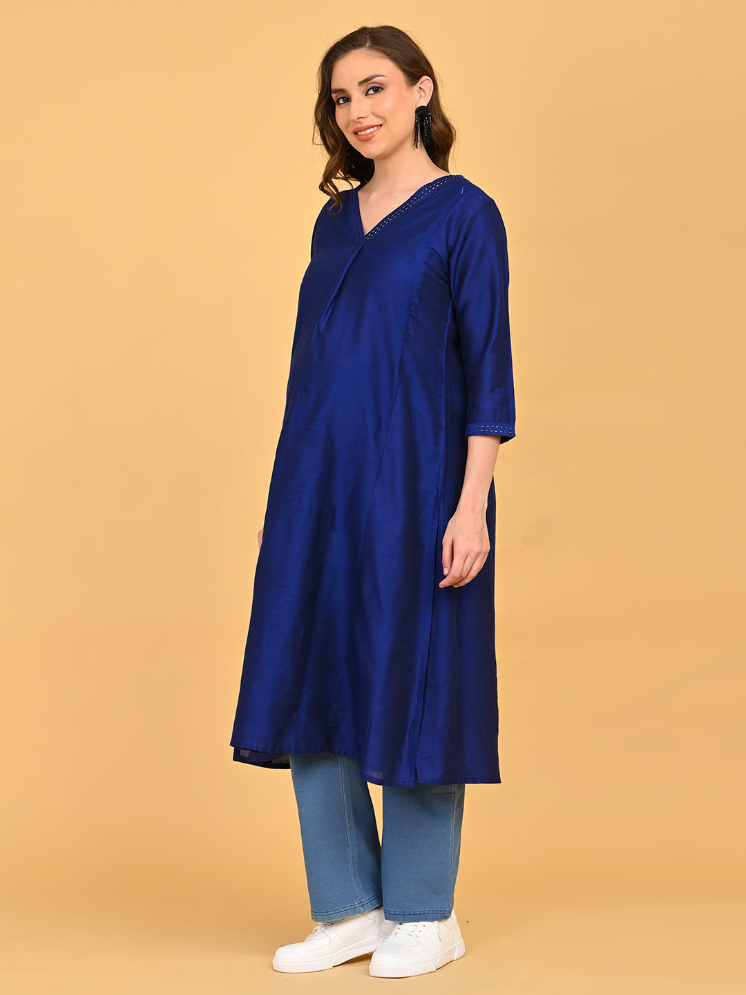 Three-quarter view of royal blue silk maternity kurta highlighting soft sheen fabric and relaxed silhouette.