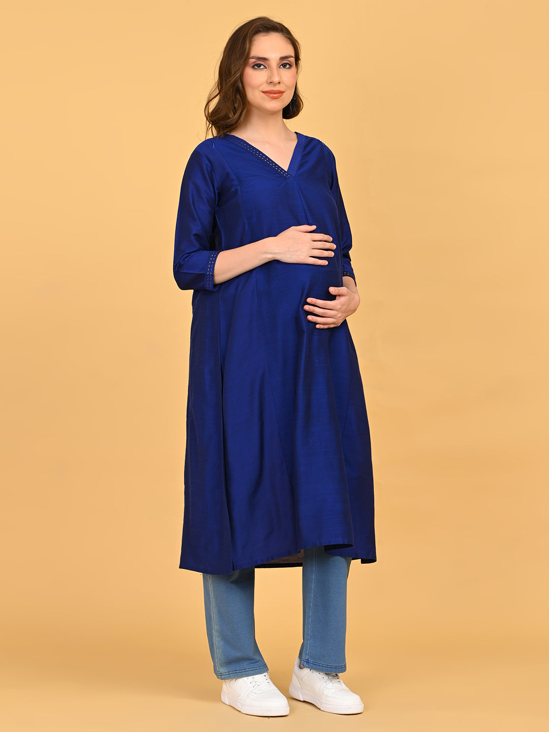 Three-quarter view of royal blue silk maternity kurta highlighting soft sheen fabric and relaxed silhouette.