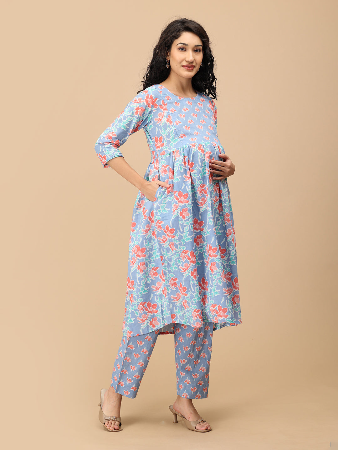 Side view of blue floral Saanjh Phool maternity kurta with empire waist – comfortable pregnancy wear.