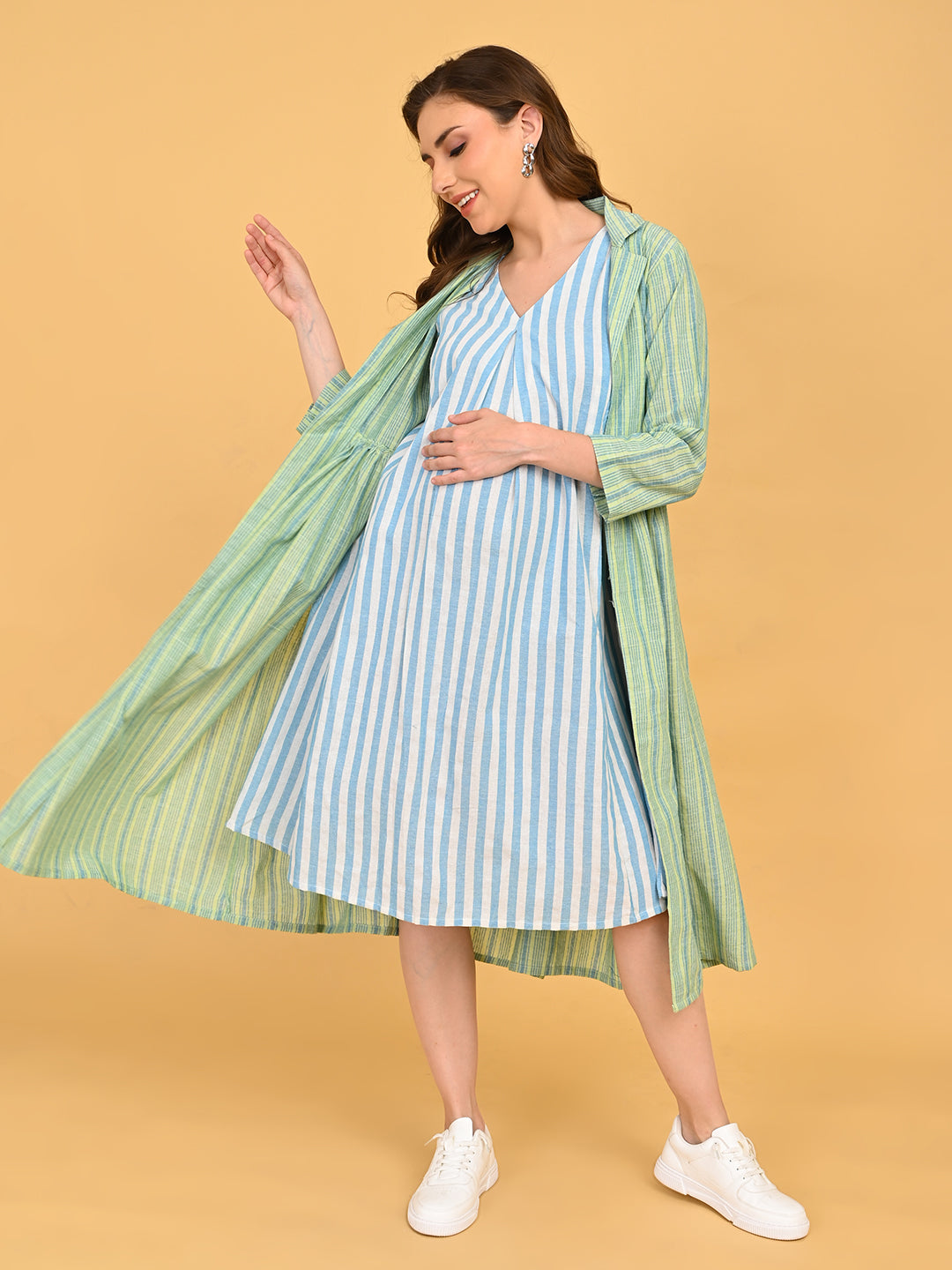 Front view of Stripe Duet maternity and nursing dress paired with open green striped shacket.