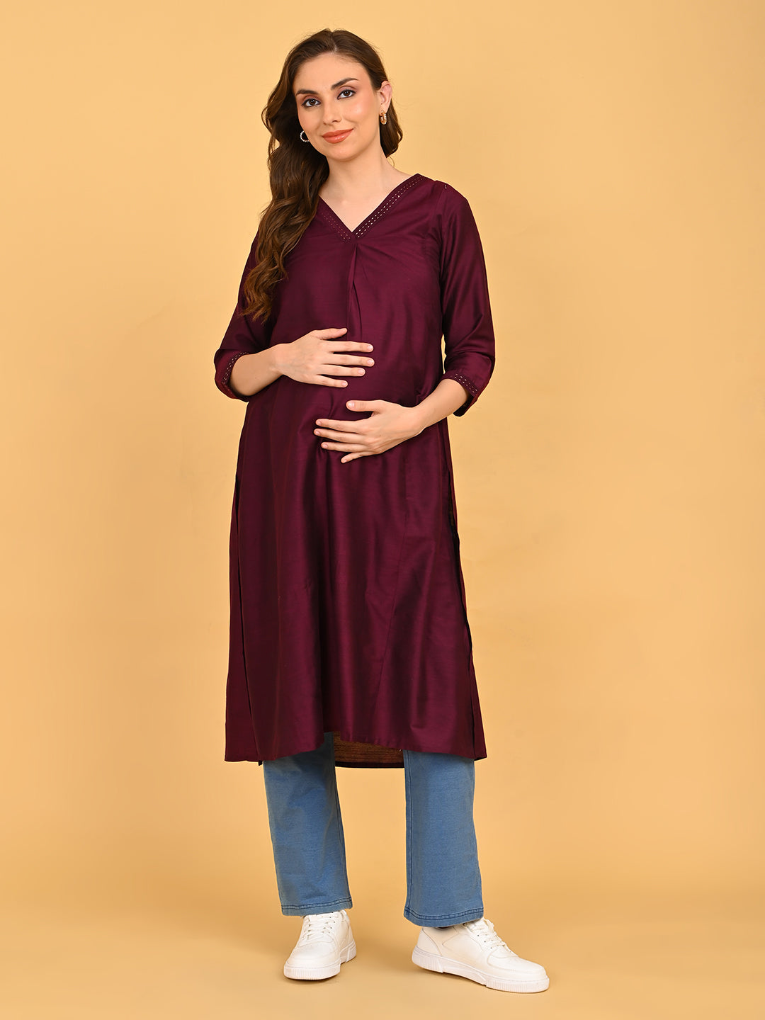 Front view of wine embroidered maternity kurta with three-quarter sleeves and knee-length design.