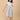 Aarohi Block Bloom Maternity and Nursing Dress ‚Äì front view of a white printed wrap-style midi dress with short sleeves.