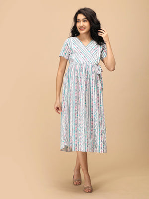 Aarohi Block Bloom Maternity and Nursing Dress ‚Äì angled front view showing V-neck wrap bodice and flowy fit.