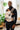 Father wearing Almitra Tattva unisex linen baby carrier with newborn in front carry, ergonomic hip support, adjustable straps, inclusive parenting babywearing carrier, sustainable and breathable fabric
