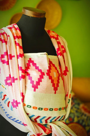 Elegant display of Almitra Tattva Shubra woven wrap showcasing breathable fabric, handcrafted geometric patterns, and vibrant bohemian woven accents.