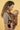 Side profile of a caregiver using the Almitra Tattva Jataka Tales ergonomic baby carrier with vibrant Kalamkari-inspired storytelling print. Soft structured baby carrier with adjustable waistband, padded shoulder straps, and ergonomic seating for safe, hands-free babywearing comfort.