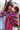 Stylish mother and baby using Almitra Tattva Larona Wrap Converted Ring Sling with colorful bohemian stripes, breathable woven baby carrier fabric, adjustable ring sling fit, and secure ergonomic babywearing comfort.