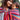 Mother carrying baby in Almitra Tattva Larona Wrap Converted Ring Sling featuring vibrant bohemian woven fabric with ergonomic babywearing support, inclusive hands free baby carrier for newborns and toddlers.
