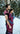 Side-view of a father using a handwoven Almitra Tattva Pema Ring Sling to carry a child in a snowy forest. The image showcases the intricate Kullu weave and the supportive, ergonomic fit of the fabric across the wearer's shoulder and the baby's back.