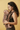 Mother carrying newborn in Almitra Tattva paisley print soft structured baby carrier in ergonomic front carry position, featuring earthy brown tones, adjustable straps, inclusive babywearing design, and breathable woven fabric for newborn comfort and parent support.