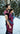 Side-view of a father using a handwoven Almitra Tattva Pema Ring Sling to carry a child in a snowy forest. The image showcases the intricate Kullu weave and the supportive, ergonomic fit of the fabric across the wearer's shoulder and the baby's back.