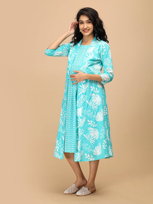 Aqua maternity and nursing dress featuring side pockets and a relaxed, knee-length fit.