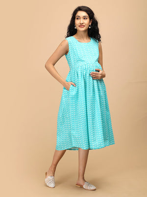 Sleeveless aqua maternity and nursing dress showing empire waist fit and comfortable pregnancy silhouette.