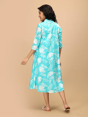 Back view of aqua printed maternity shacket dress with three-quarter sleeves and relaxed fit.