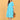 Aquamarine Affair Maternity and Nursing Dress featuring an empire waist, V-neckline, and all-over print, paired with white sneakers and a structured tan handbag.