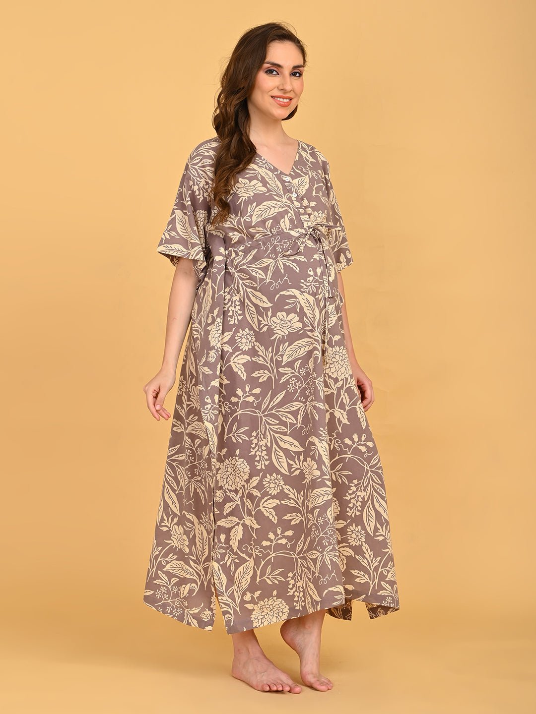 Aura in Bloom Maternity and Nursing Kaftan Nighty three-quarter front view with model smiling, showcasing floral print and relaxed kaftan silhouette. 