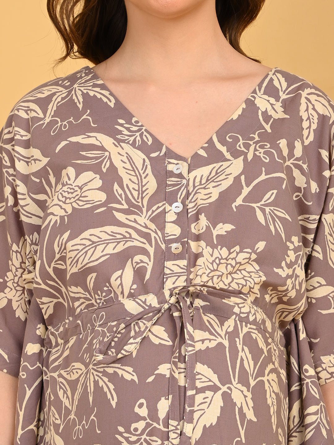 Aura in Bloom Maternity and Nursing Kaftan Nighty front view with hands near neckline, emphasizing button-down nursing feature.