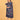 Close-up of blue floral maternity dress with V-neckline, model holding orange leaves near baby bump.