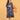 Front view of pregnant model in blue floral maternity dress with three-quarter sleeves and relaxed fit.