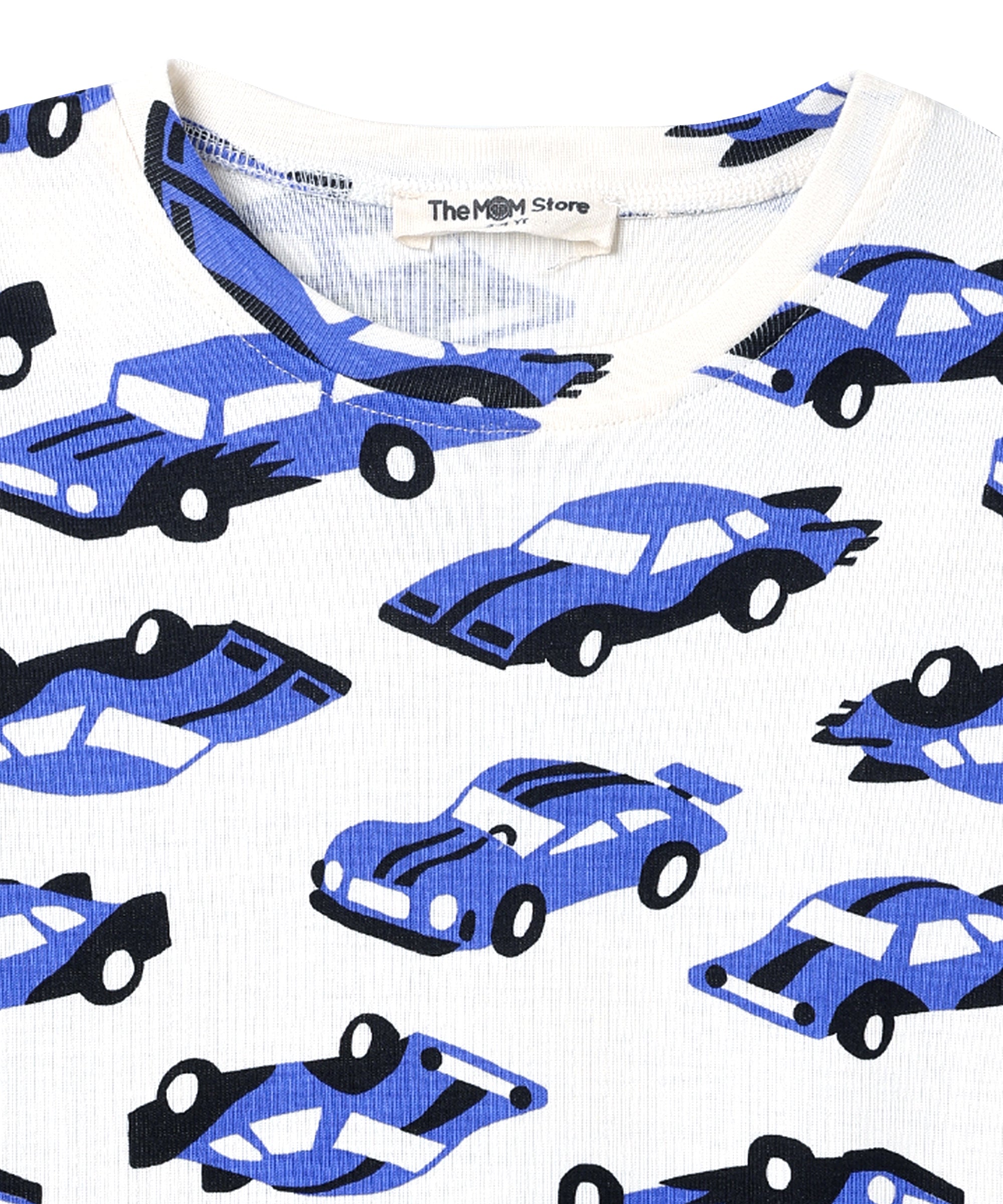 Neckline close-up of The Mom Store Zoomy Dreams pajama top showing brand tag and car print details.