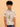 Child wearing a patterned shirt and jeans on a beige background