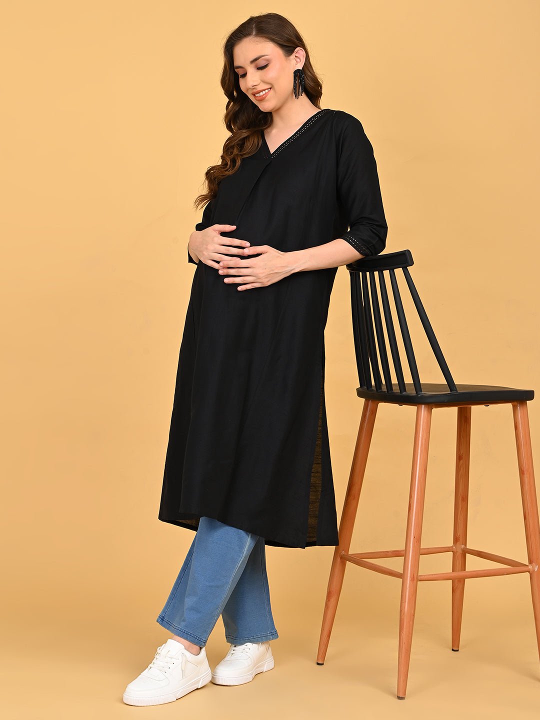 Full-length view of black embroidered maternity and nursing silk kurta with relaxed straight silhouette.