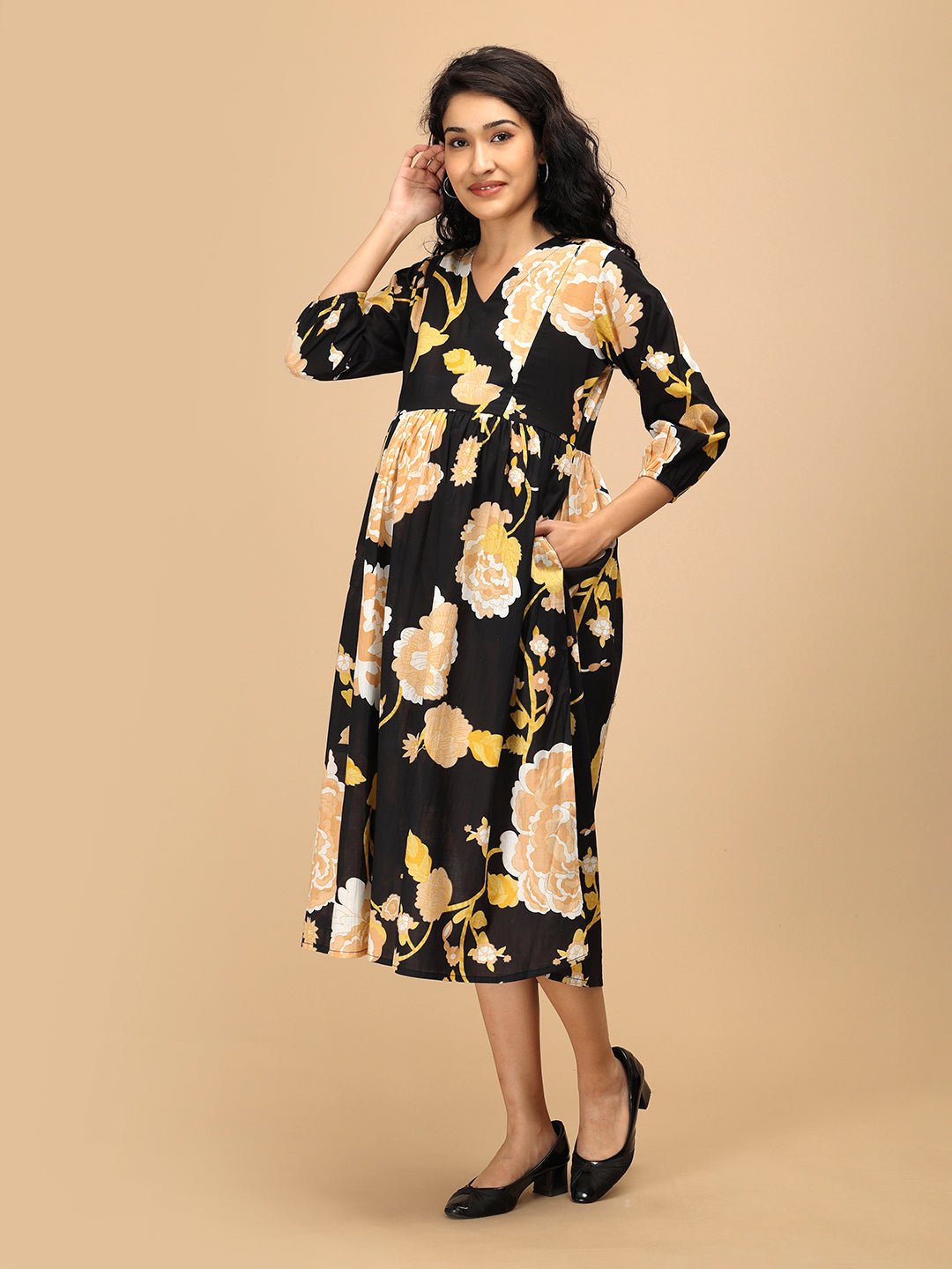 Three-quarter view of Black Peony Maternity and Nursing Dress with soft gathers for bump comfort.