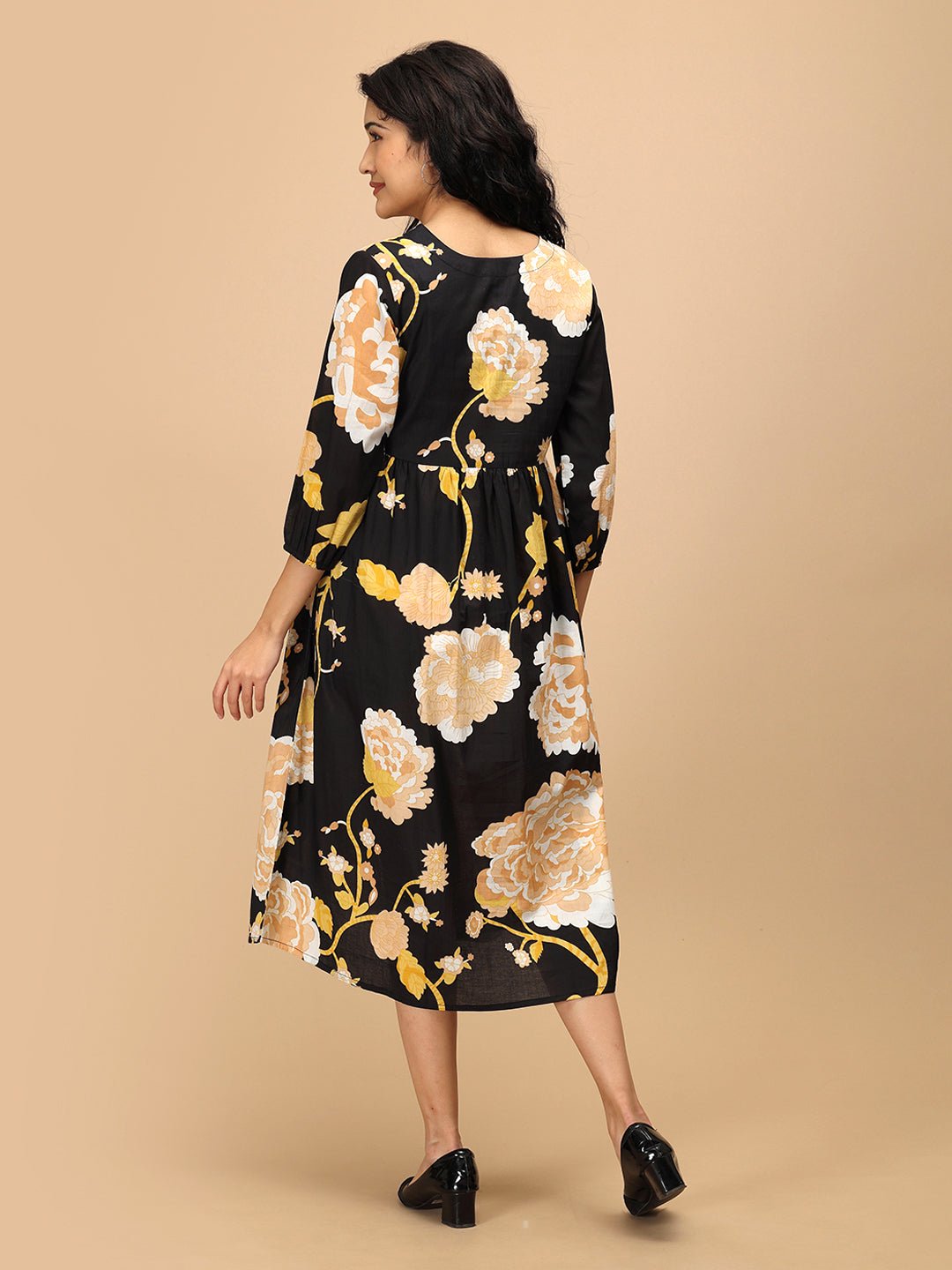 Back view of Black Peony Maternity and Nursing Dress showing relaxed silhouette and floral pattern.