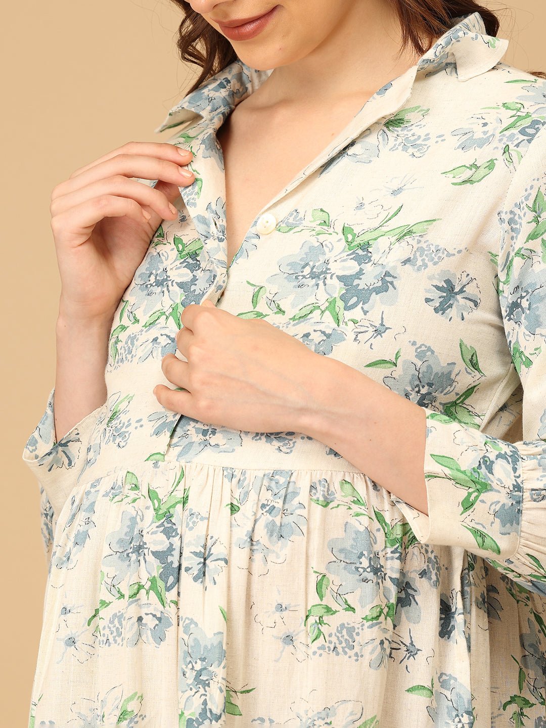 Woman wearing a floral dress with a beige background