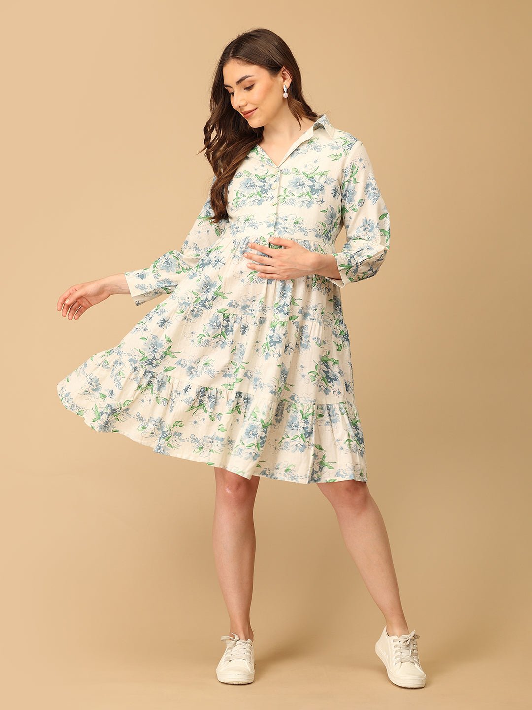 Woman wearing a floral dress on a beige background