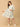 Woman wearing a floral dress on a beige background
