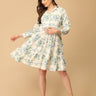 Woman wearing a floral dress on a beige background