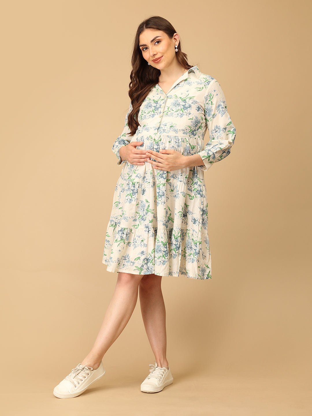 Woman wearing a floral dress on a beige background