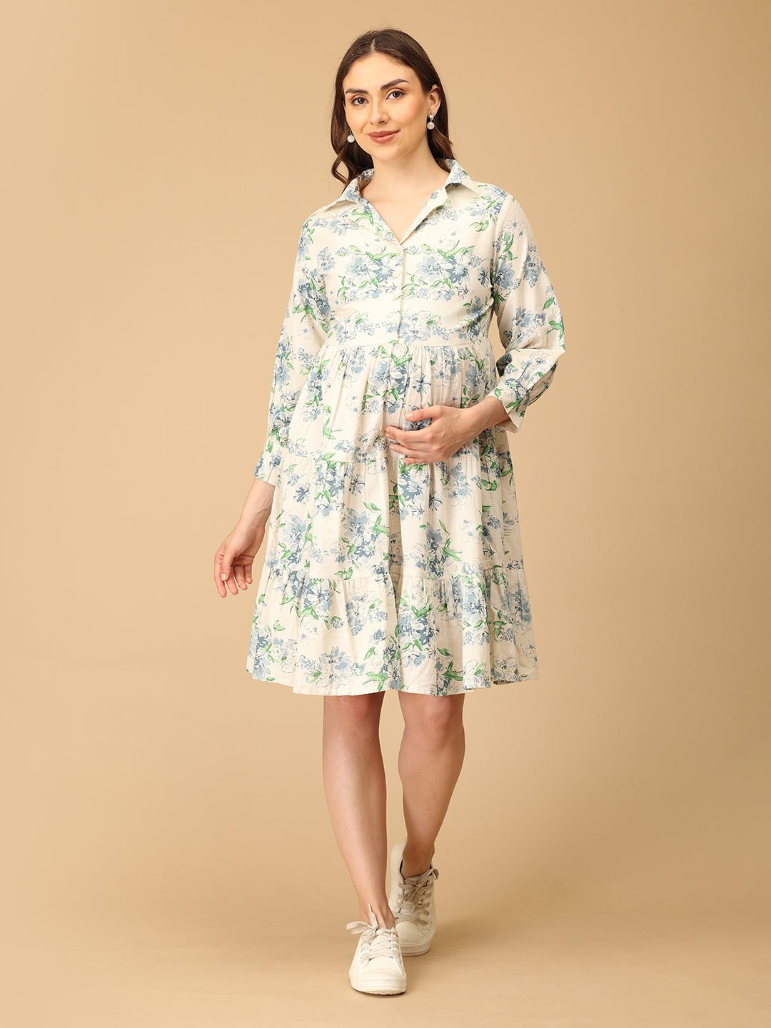 Woman wearing a floral dress on a beige background