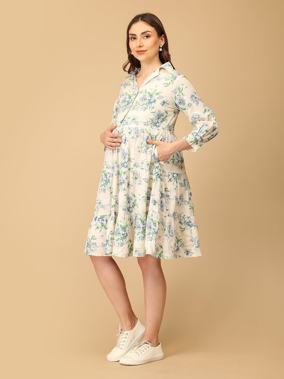 Woman wearing a floral dress on a beige background